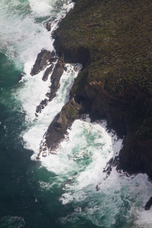 Waves Breaking On Headland