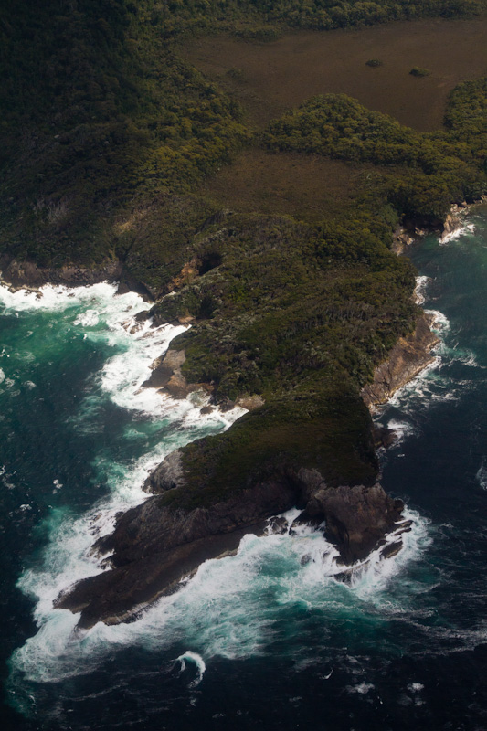 Waves Breaking On Headland