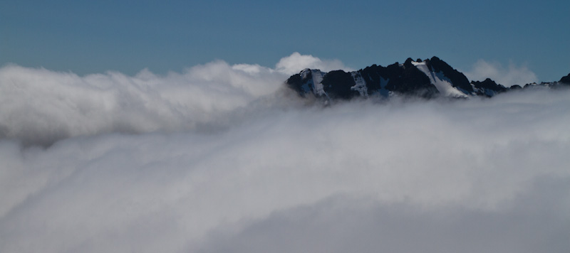 Johannesberg Mountain Jutting Out Of Clouds