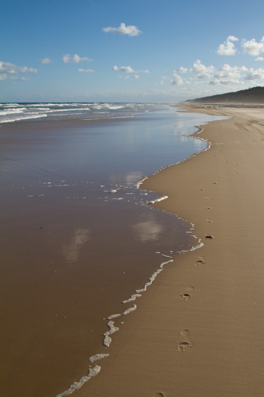 Footprints On Beach