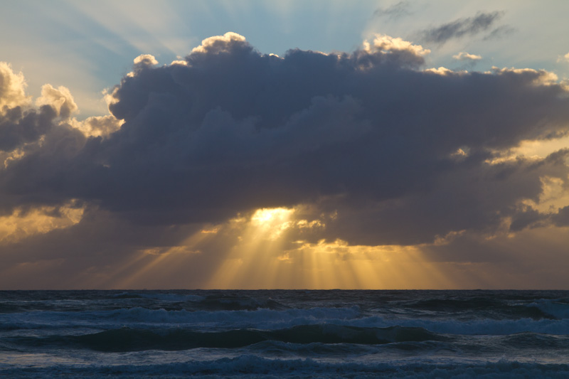 Sun Rising Behind Cloud Bank