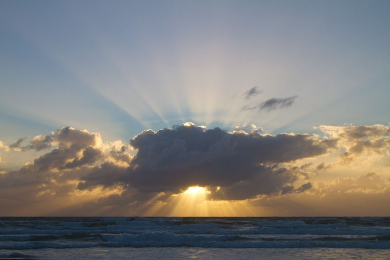 Sun Rising Behind Cloud Bank