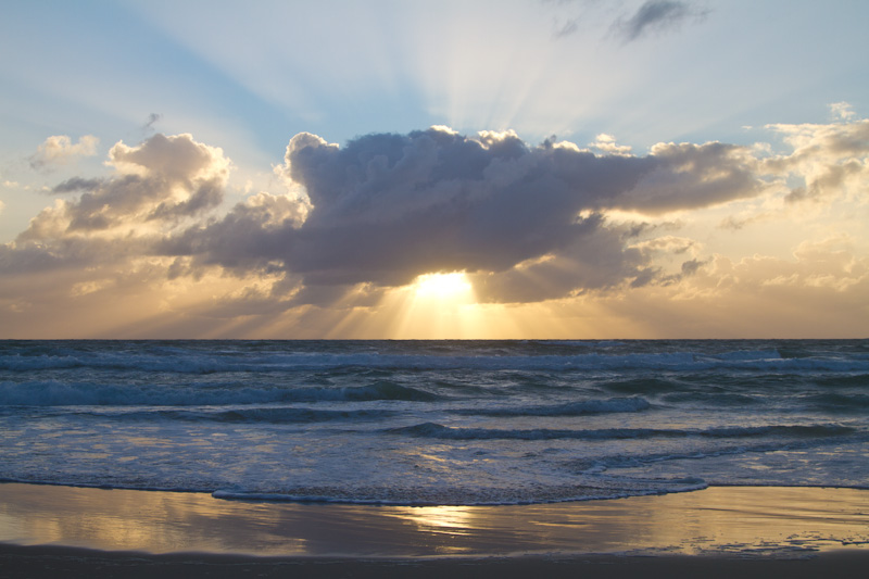 Sun Rising Behind Cloud Bank