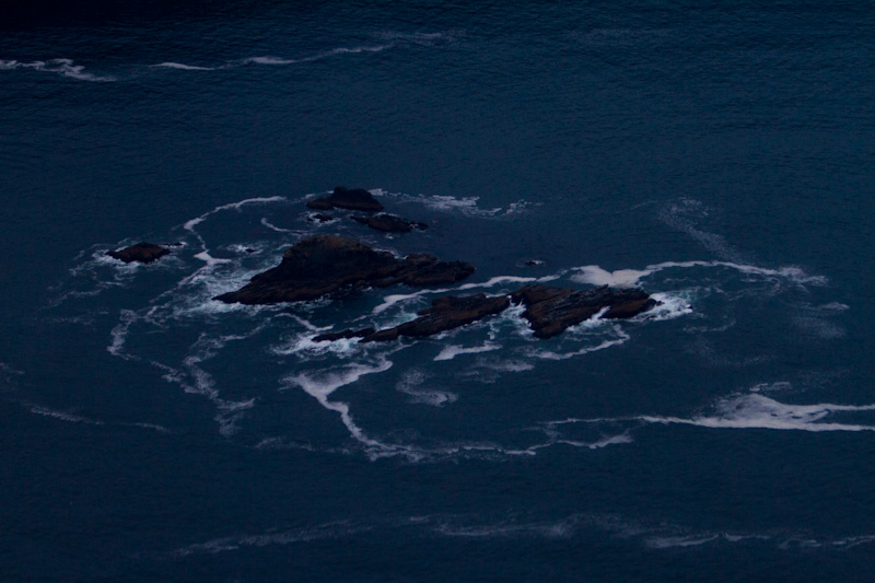 Waves Breaking Over Rocks