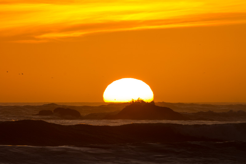 Sun Setting Behind Waves