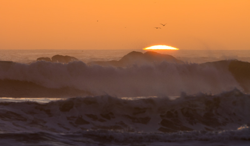 Sun Setting Behind Waves