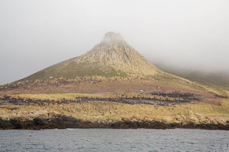 Peak Of Steeple Jason Island Enshrouded In Clouds