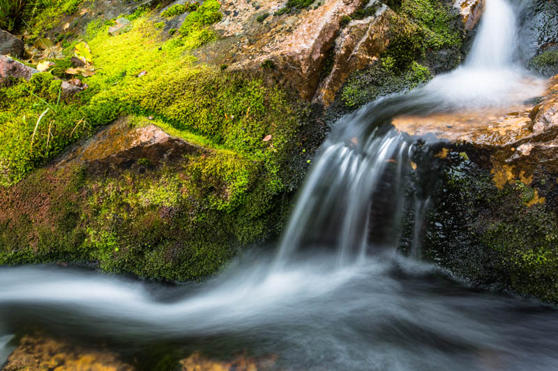 Small Cascade And Moss Covered Rock